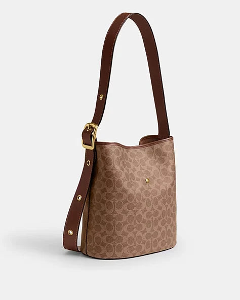 OUVALIA Luxury Edit | Coach BLEECKER BUCKET BAG IN SIGNATURE CANVAS