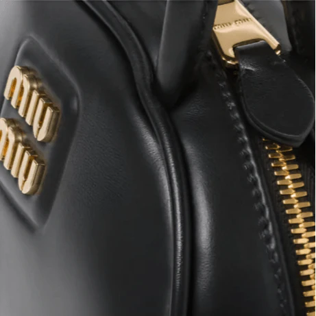 OUVALIA Luxury Edit | Miu Miu Leather Top-Handle Bag With Metal Lettering Logo And Gold-Tone Hardware Black